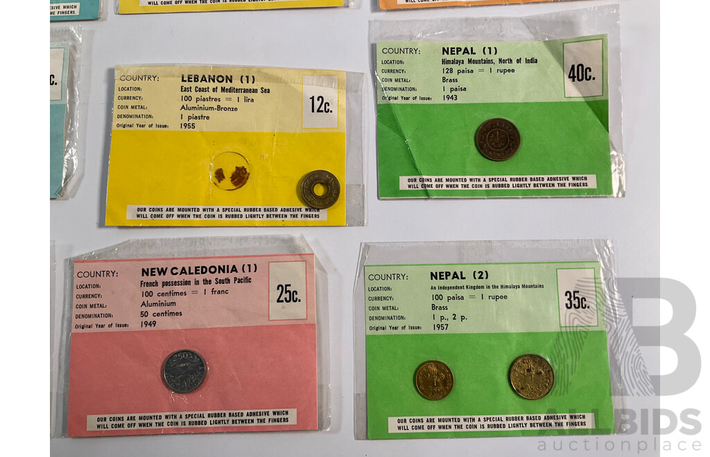 Collection of Vintage International Carded Coins, Chinese Confucius Medallion Two Singapore Sir Thomas Raffles Medallions, Two Papua New Guinea 1998 Fifty Toea Coins, Bank of PNG Silver Jubilee