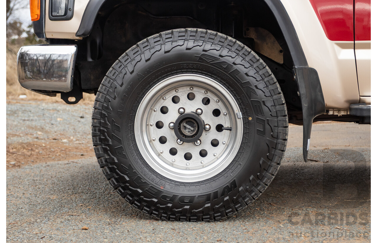 10/1994 Nissan Patrol ST SWB Series 2 (4x4) KY60 GQ 2d Hardtop Big Red / Desert Sand 4.2L