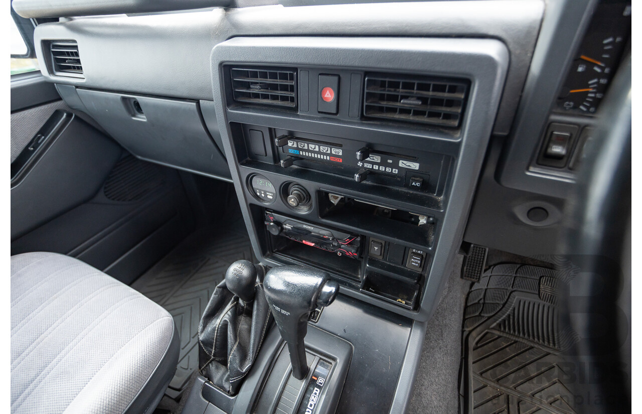 10/1994 Nissan Patrol ST SWB Series 2 (4x4) KY60 GQ 2d Hardtop Big Red / Desert Sand 4.2L