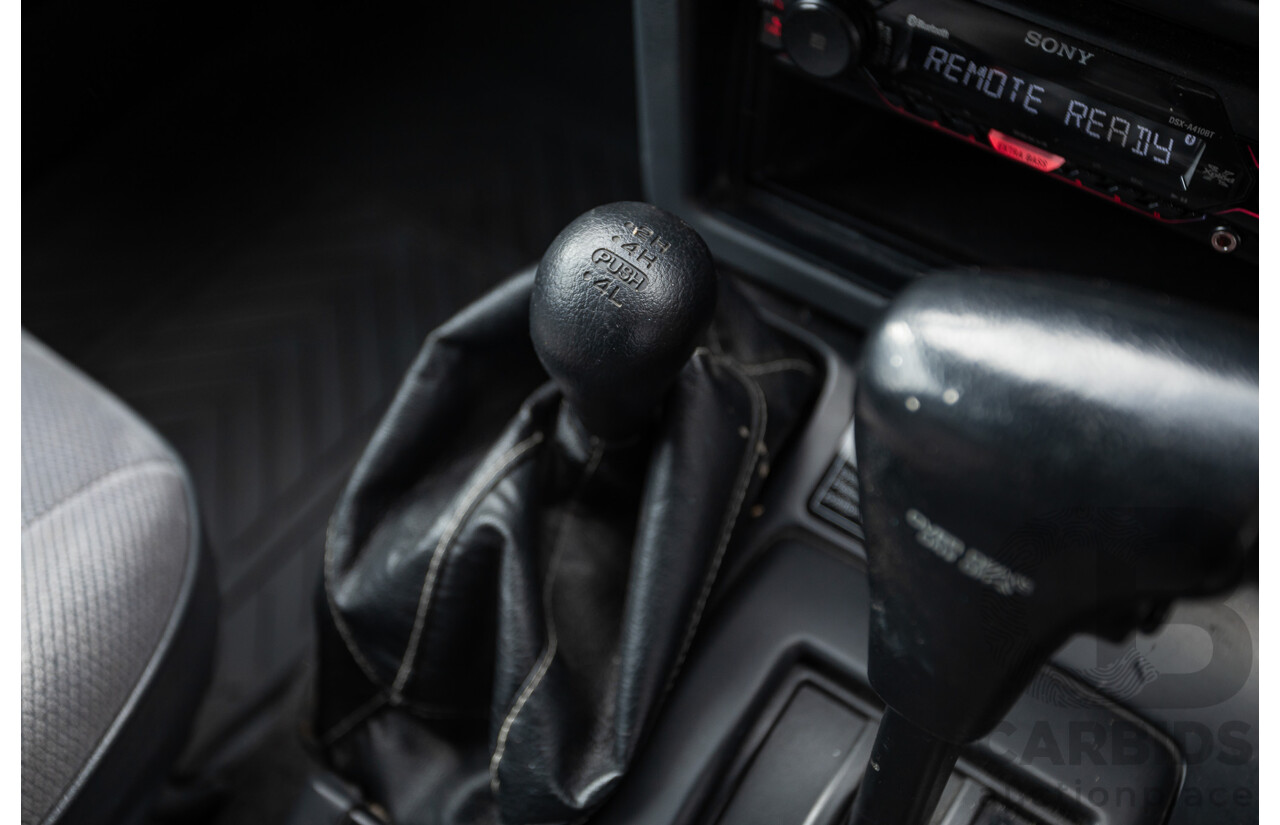 10/1994 Nissan Patrol ST SWB Series 2 (4x4) KY60 GQ 2d Hardtop Big Red / Desert Sand 4.2L