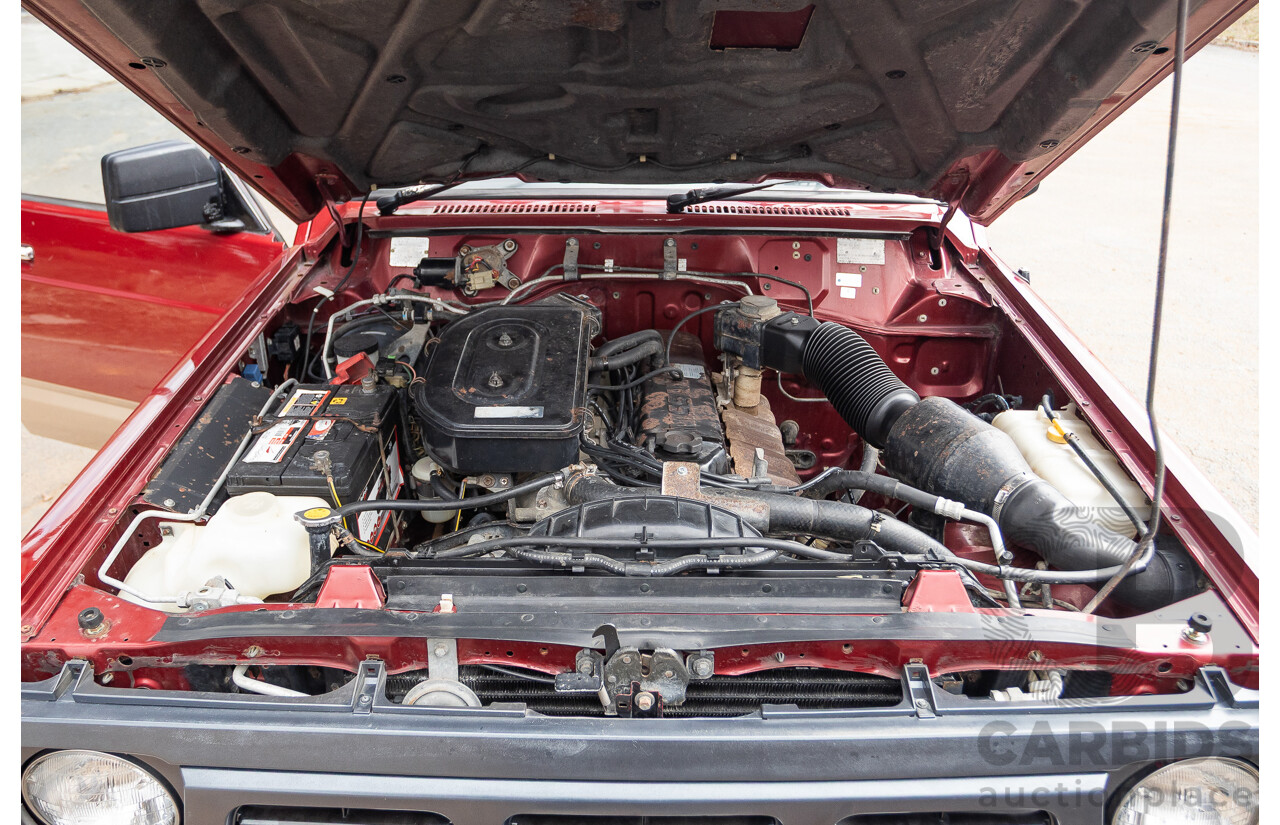 10/1994 Nissan Patrol ST SWB Series 2 (4x4) KY60 GQ 2d Hardtop Big Red / Desert Sand 4.2L