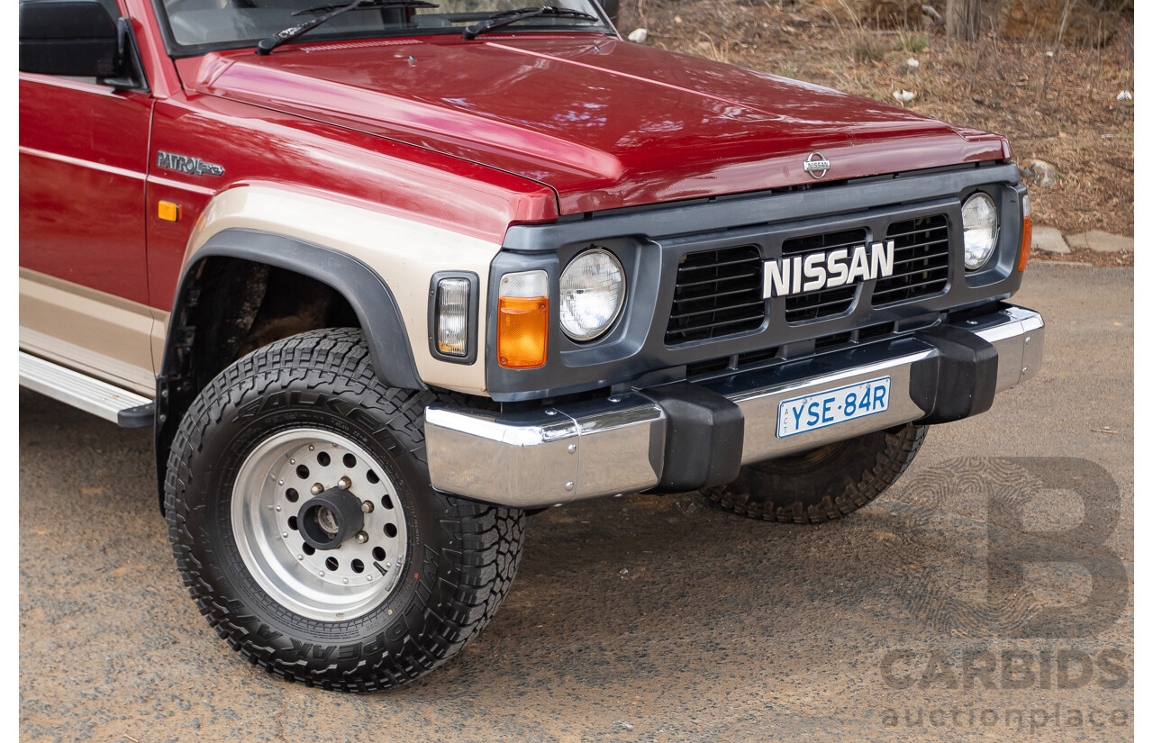 10/1994 Nissan Patrol ST SWB Series 2 (4x4) KY60 GQ 2d Hardtop Big Red / Desert Sand 4.2L