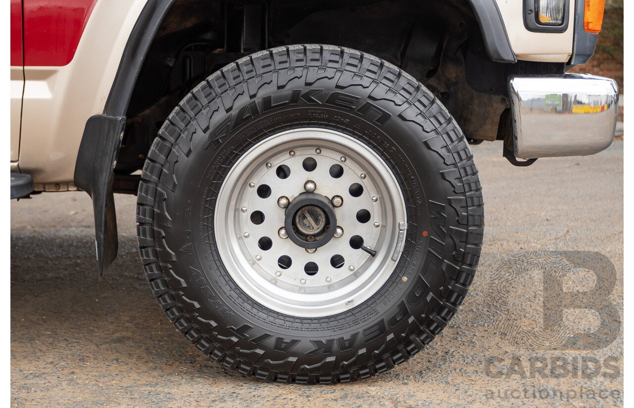 10/1994 Nissan Patrol ST SWB Series 2 (4x4) KY60 GQ 2d Hardtop Big Red / Desert Sand 4.2L