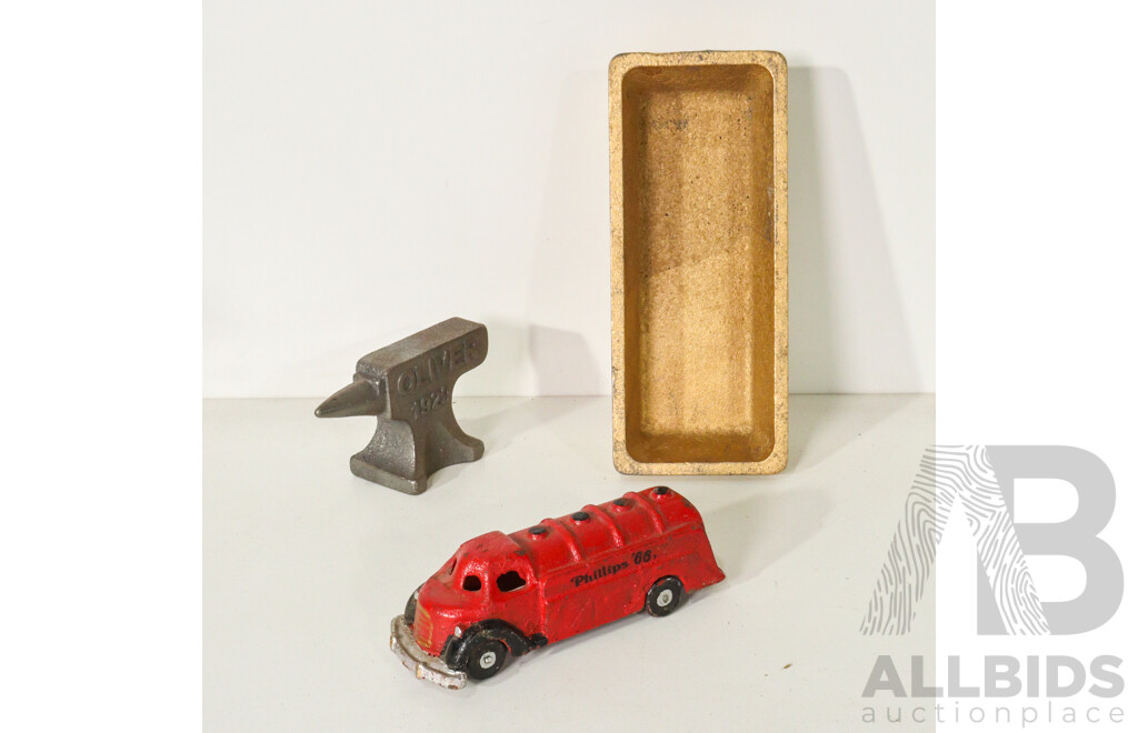 Assorted Cast Iron Pieces Including Gold Bar, Anvil, and Phillips '66 Truck