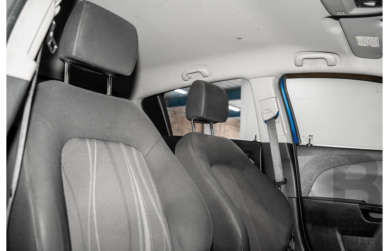 9/2012 Holden Barina TM 5d Hatchback Bocaray Blue Metallic 1.6L