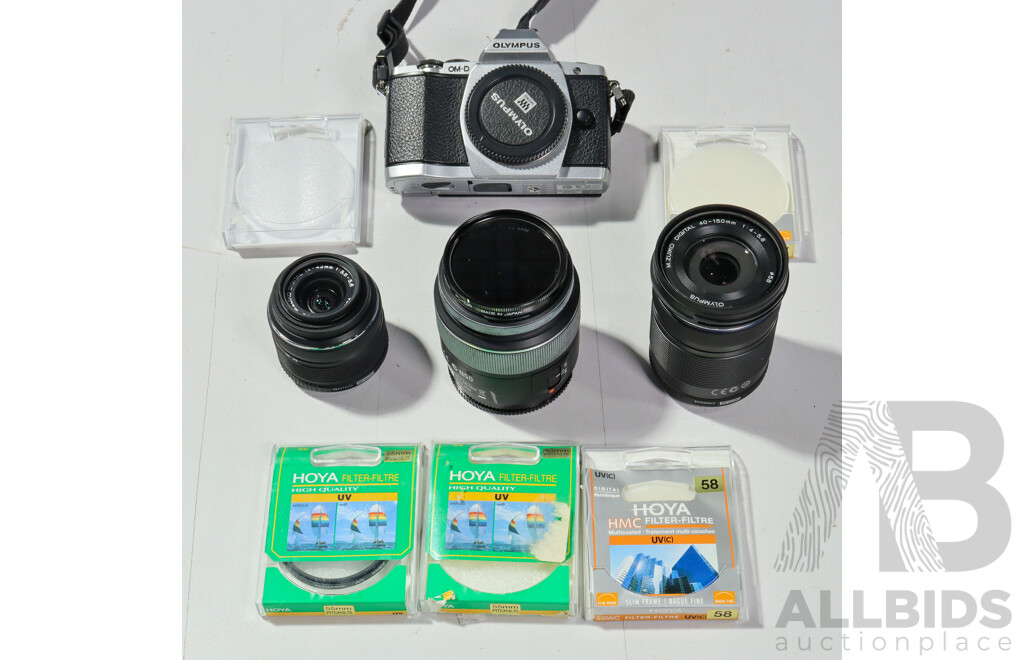 Collection Camera Equipment Including Olympus OM D Camera, Sony SAL 1855 Lens, Two Olympus Digital Lenses and More