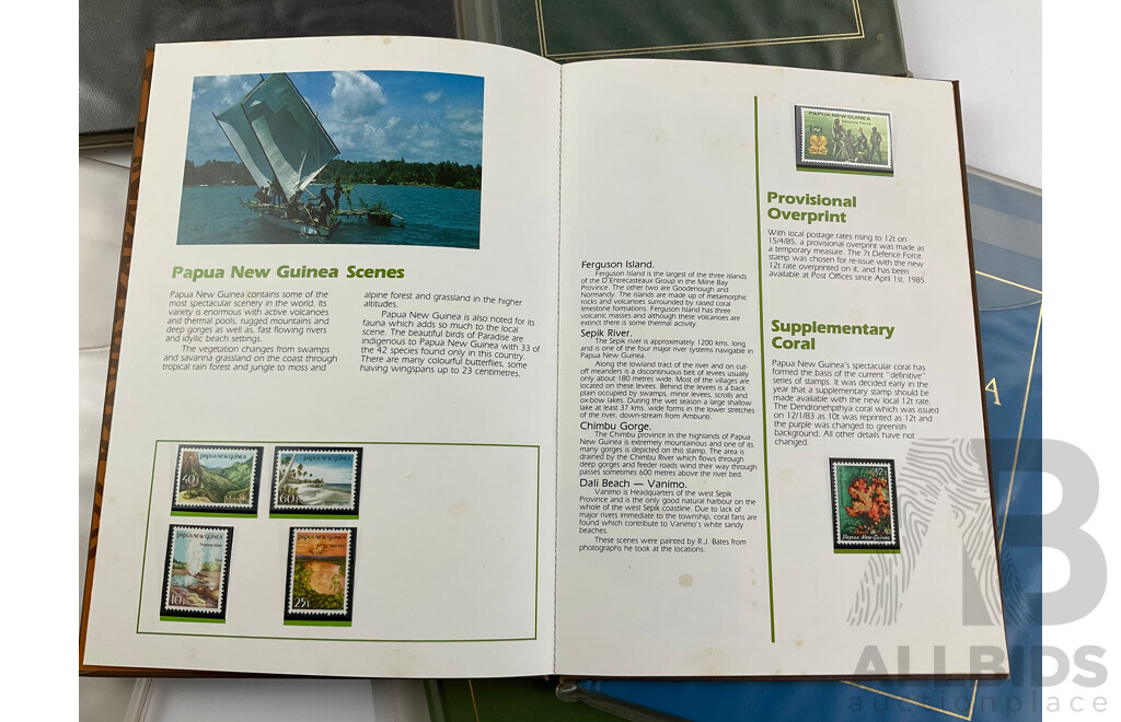 Two Australian Annual Stamp Albums 1984 and 1985 - Face Value $49 with Three Papua New Guinea Albums 1985, 1986, 1987