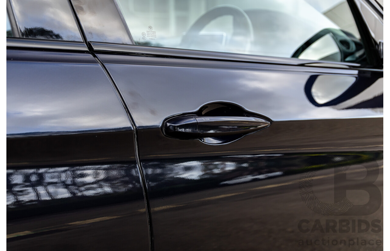 11/2014 BMW X6 M50d E71 MY14 4d Coupe Carbon Black Metallic Triple Turbo Diesel 3.0L