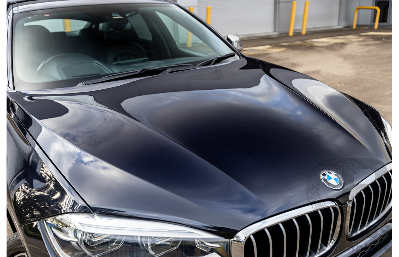 11/2014 BMW X6 M50d E71 MY14 4d Coupe Carbon Black Metallic Triple Turbo Diesel 3.0L