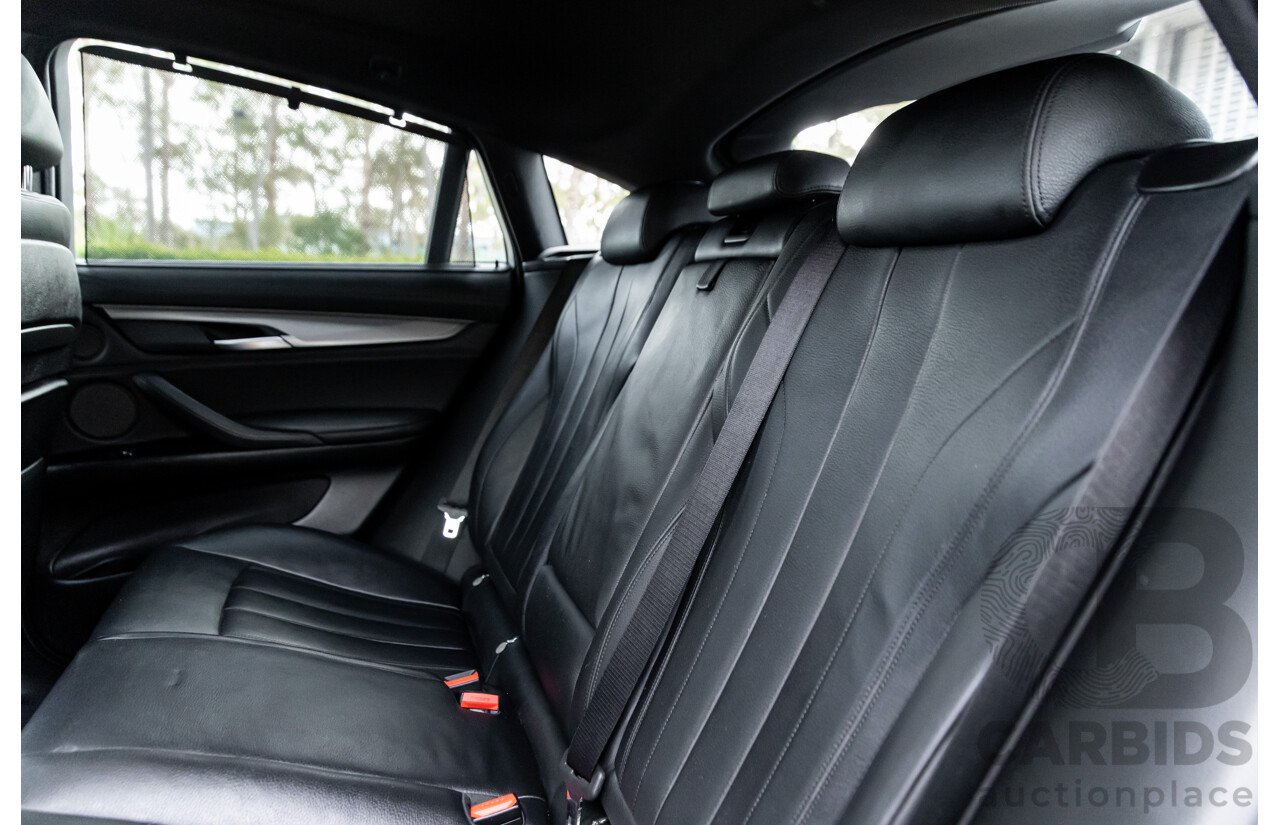 11/2014 BMW X6 M50d E71 MY14 4d Coupe Carbon Black Metallic Triple Turbo Diesel 3.0L