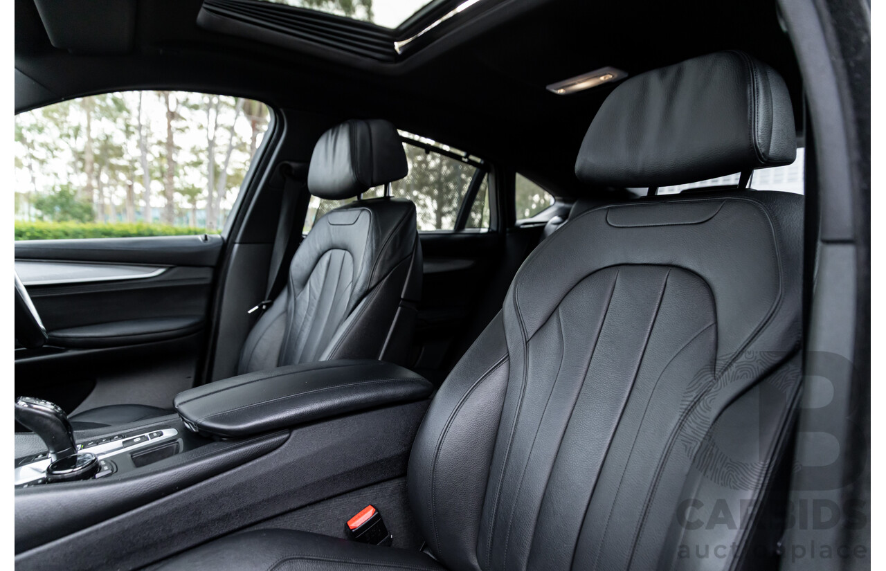 11/2014 BMW X6 M50d E71 MY14 4d Coupe Carbon Black Metallic Triple Turbo Diesel 3.0L
