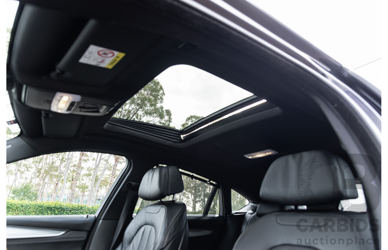 11/2014 BMW X6 M50d E71 MY14 4d Coupe Carbon Black Metallic Triple Turbo Diesel 3.0L