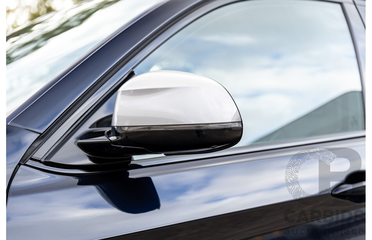 11/2014 BMW X6 M50d E71 MY14 4d Coupe Carbon Black Metallic Triple Turbo Diesel 3.0L