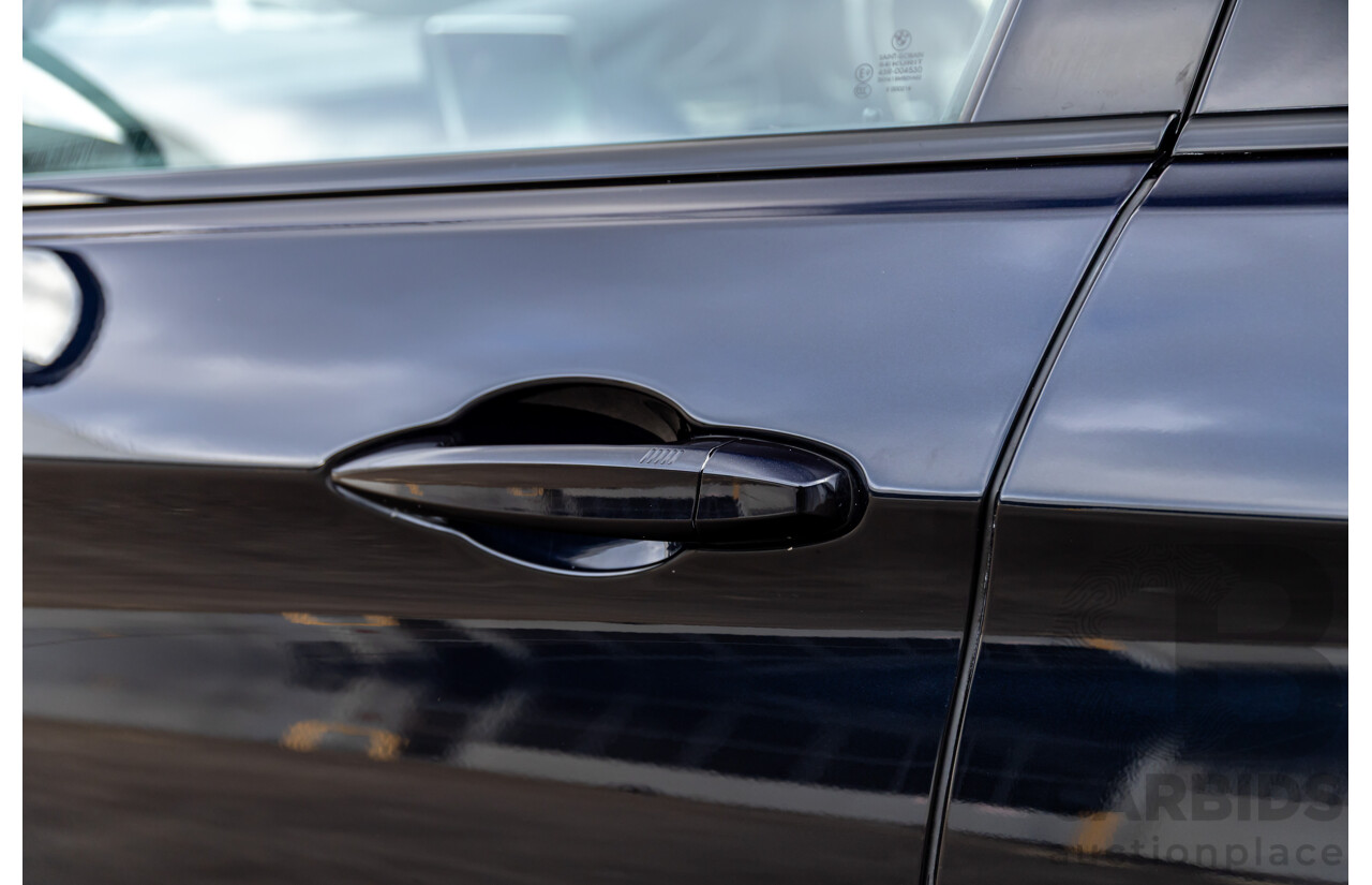 11/2014 BMW X6 M50d E71 MY14 4d Coupe Carbon Black Metallic Triple Turbo Diesel 3.0L