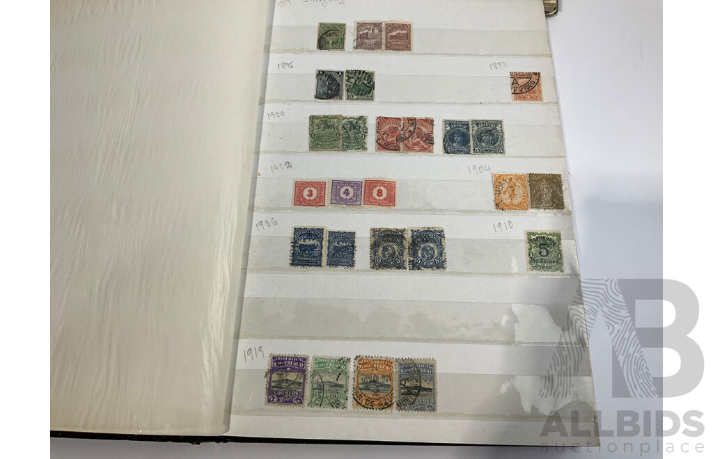Two Albums of Antique and Vintage International Mint and Cancelled Stamps Including Zanzibar Nigeria, Guernsey, Zimbabwe, Zaire, Uruguay, Paraguay, Mexico, Brazil, Guyana, Colombia and More