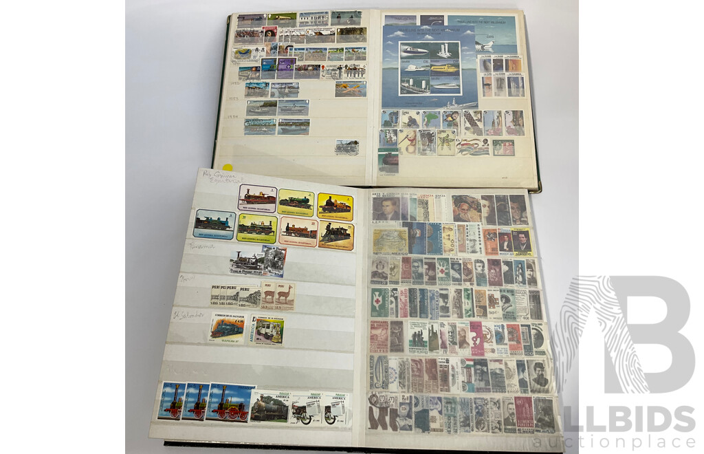 Two Albums of Antique and Vintage International Mint and Cancelled Stamps Including Zanzibar Nigeria, Guernsey, Zimbabwe, Zaire, Uruguay, Paraguay, Mexico, Brazil, Guyana, Colombia and More