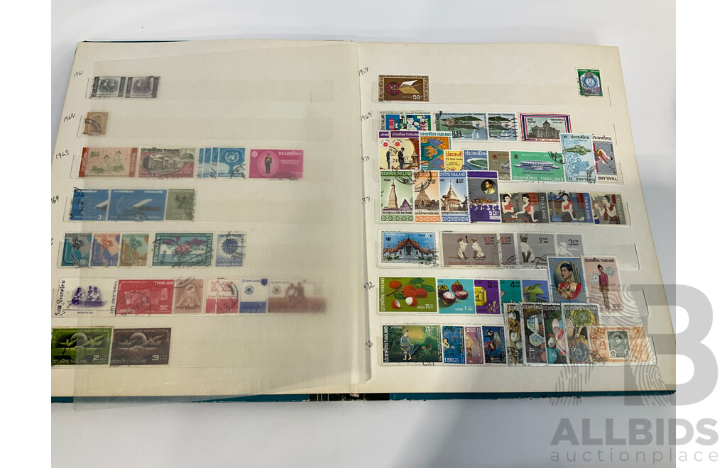 Three Albums of Vintage Cancelled and Mint Stamps Including Australia, Liberia, Mongolia, Thailand, Spain