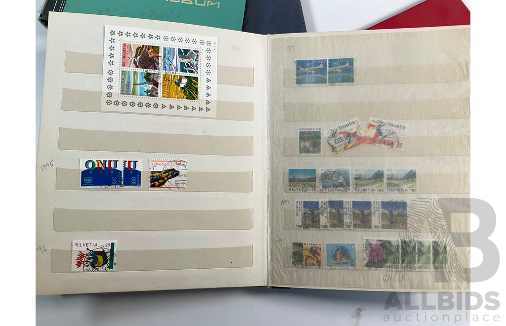 Four Albums of International Mint and Cancelled Stamps Including Switzerland Examples Spanning 1908 to 1980's, Gibraltar, St Vincent, Vietnam, Poland