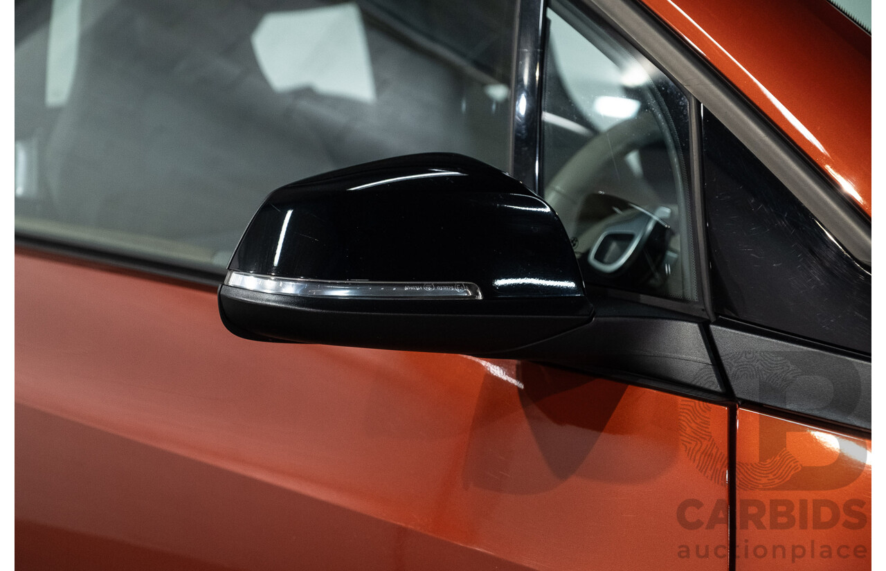 05/2015 BMW i3 REx Hybrid (RWD) IO1 4d Hatchback Solar Orange Metallic/Fluid Black 0.6L - 125kW