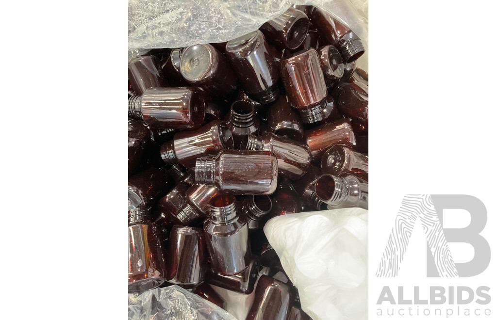 Large Bag Filled with Amber Plastic Bottles