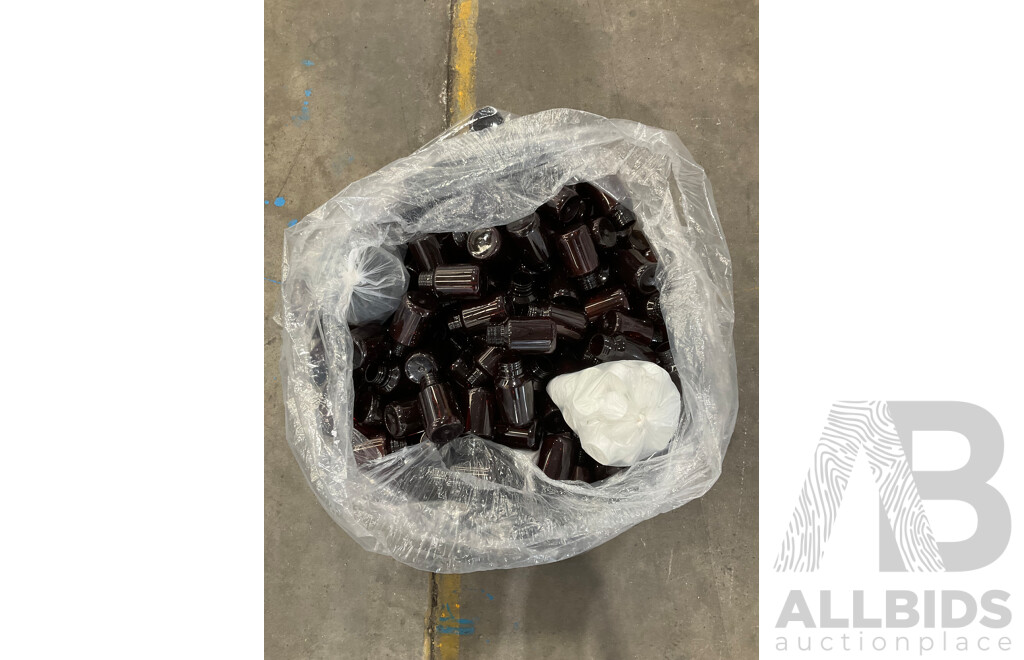 Large Bag Filled with Amber Plastic Bottles