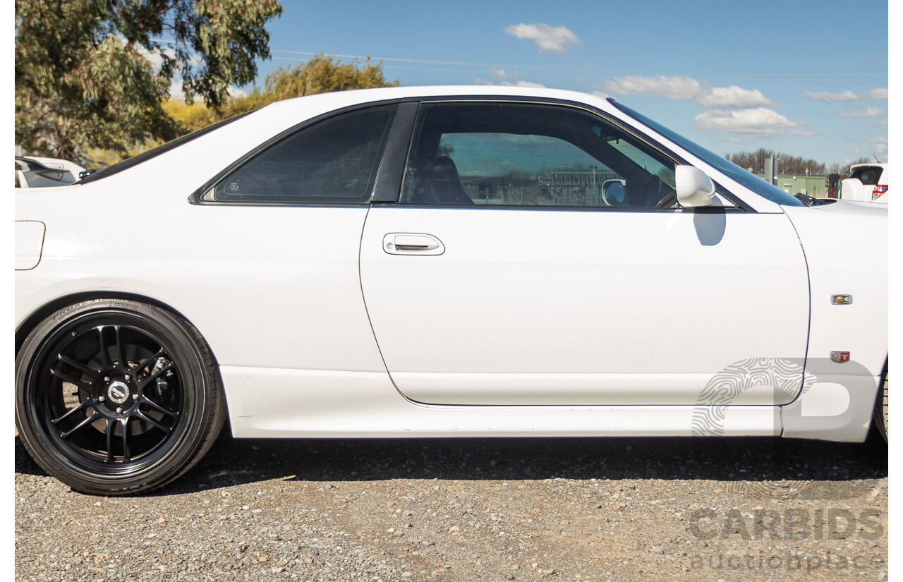04/1997 Nissan Skyline R33 GT-R Series 3 BNR33 (AWD) 2d Coupe QM1 Polar White Turbo 2.6L - Modified 850hp+ - 05/2009 Import