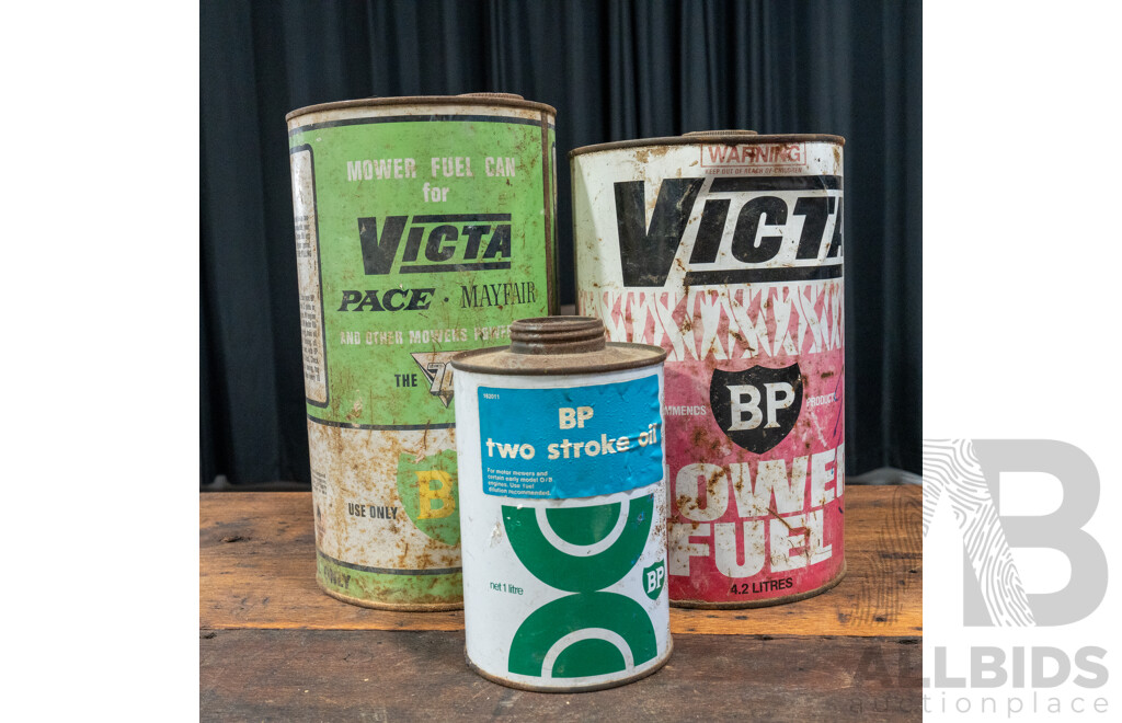 Pair of Vintage Victa Two Strike Tins and BP Example