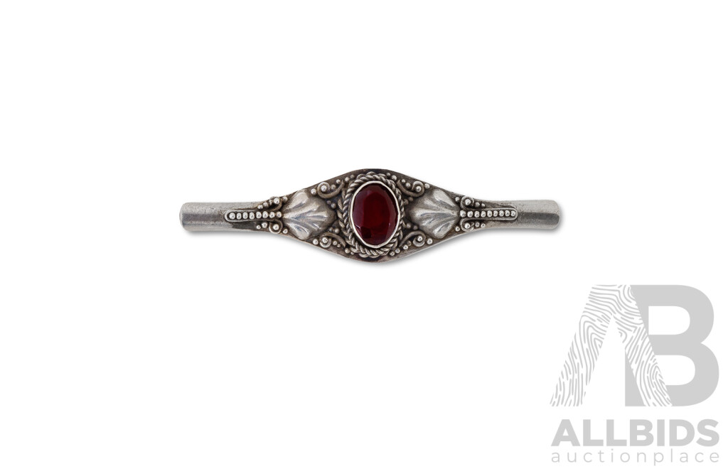 Sterling Silver Garnet Set Bracelet and Brooch Eight Link Bracelet with Floral Design, Each Link Set with Oval Garnet. Together with a Matching Bar Brooch.