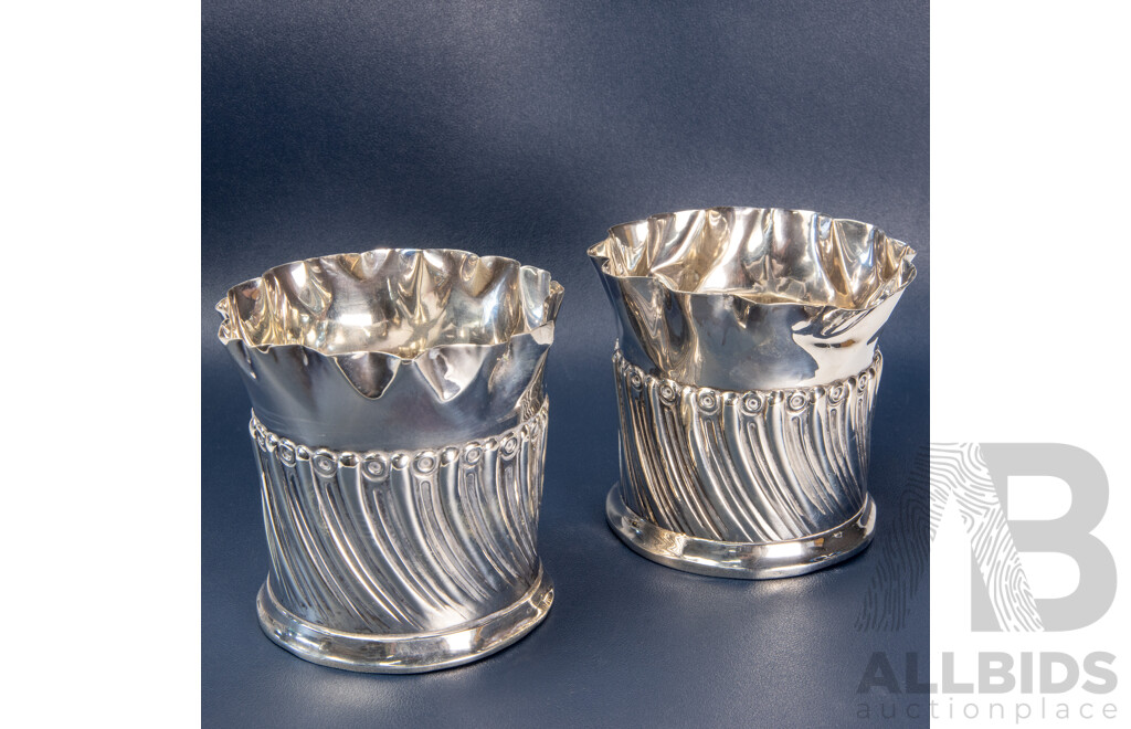 Pair of Repoussé William Comyns Sterling Silver Bottle Coasters, London, C.1893
