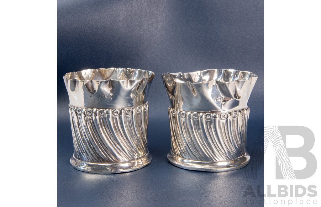 Pair of Repoussé William Comyns Sterling Silver Bottle Coasters, London, C.1893