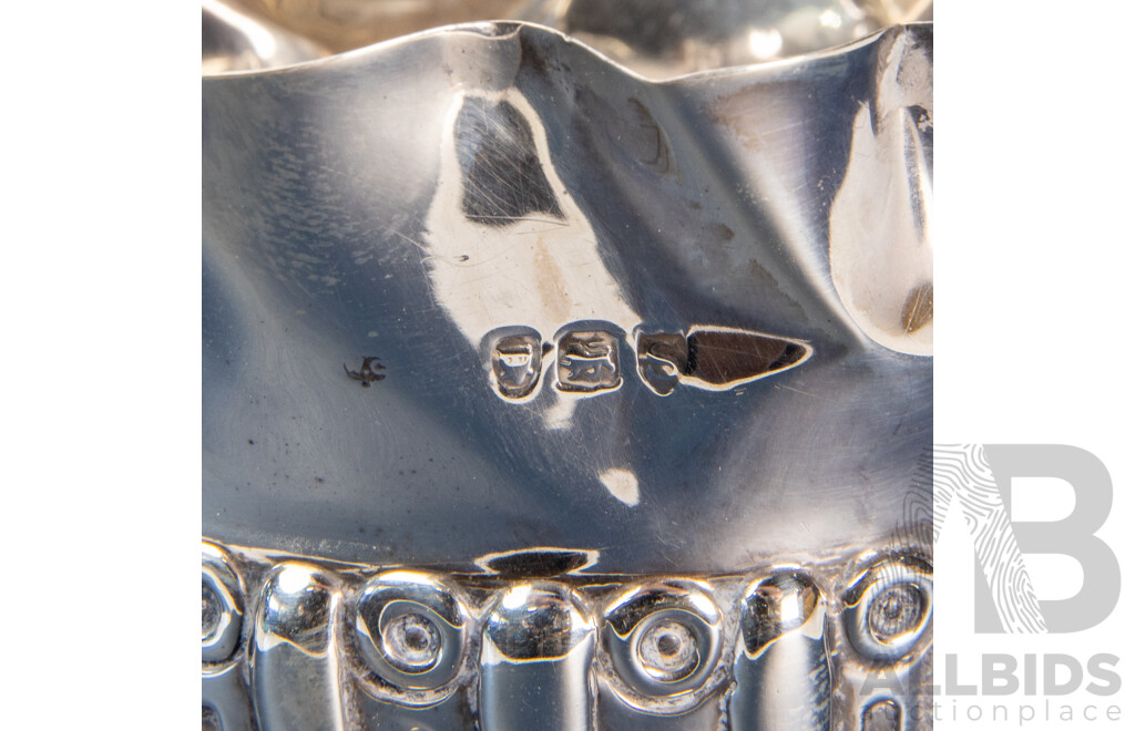 Pair of Repoussé William Comyns Sterling Silver Bottle Coasters, London, C.1893