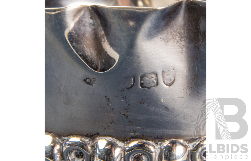 Pair of Repoussé William Comyns Sterling Silver Bottle Coasters, London, C.1893