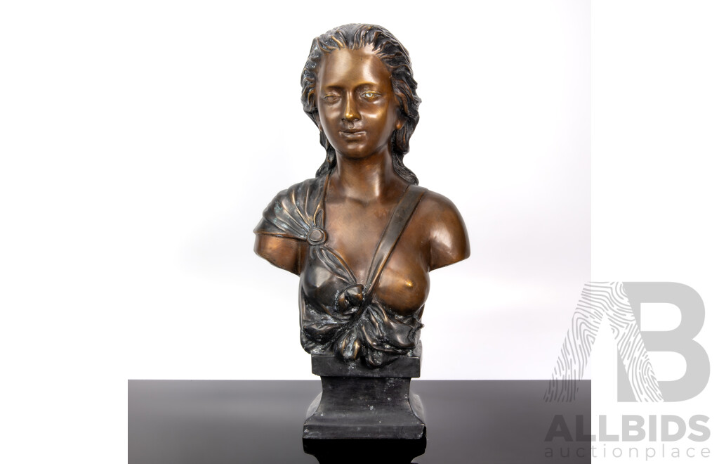 Bronze Bust of a Woman with Bared Breast and Flowing Hair