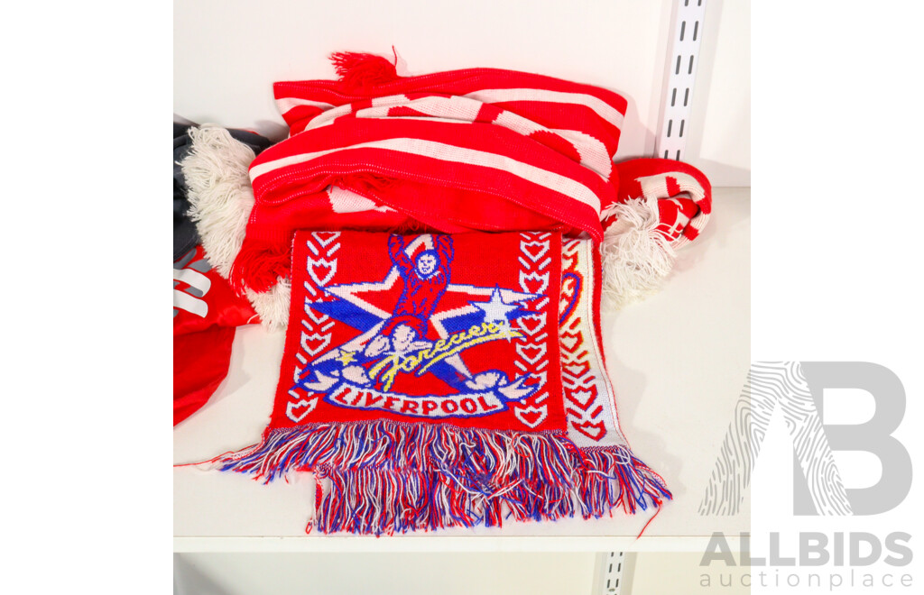 Collection of Official Liverpool Football Club Supporter Gear Including Jerseys, Scarves and Towels