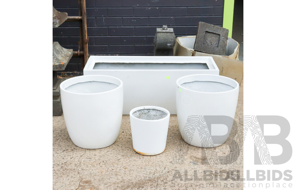 Collection of Four Plastic Planters