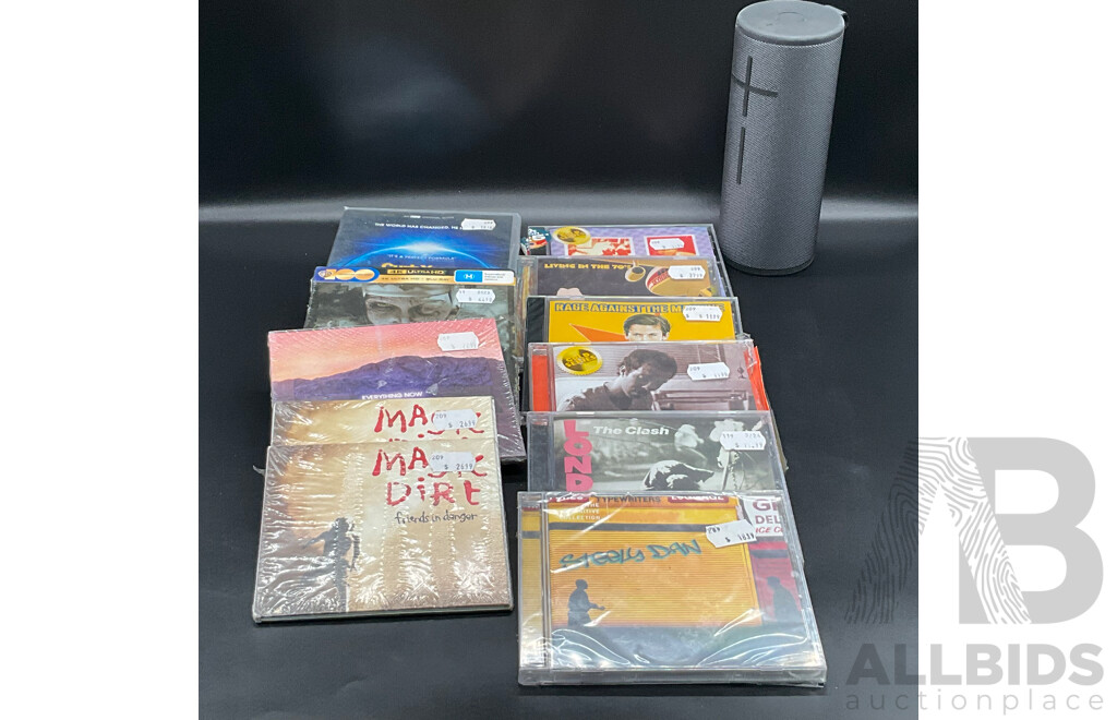 Assorted CDs/DVDs and Ultimate Ears Speaker