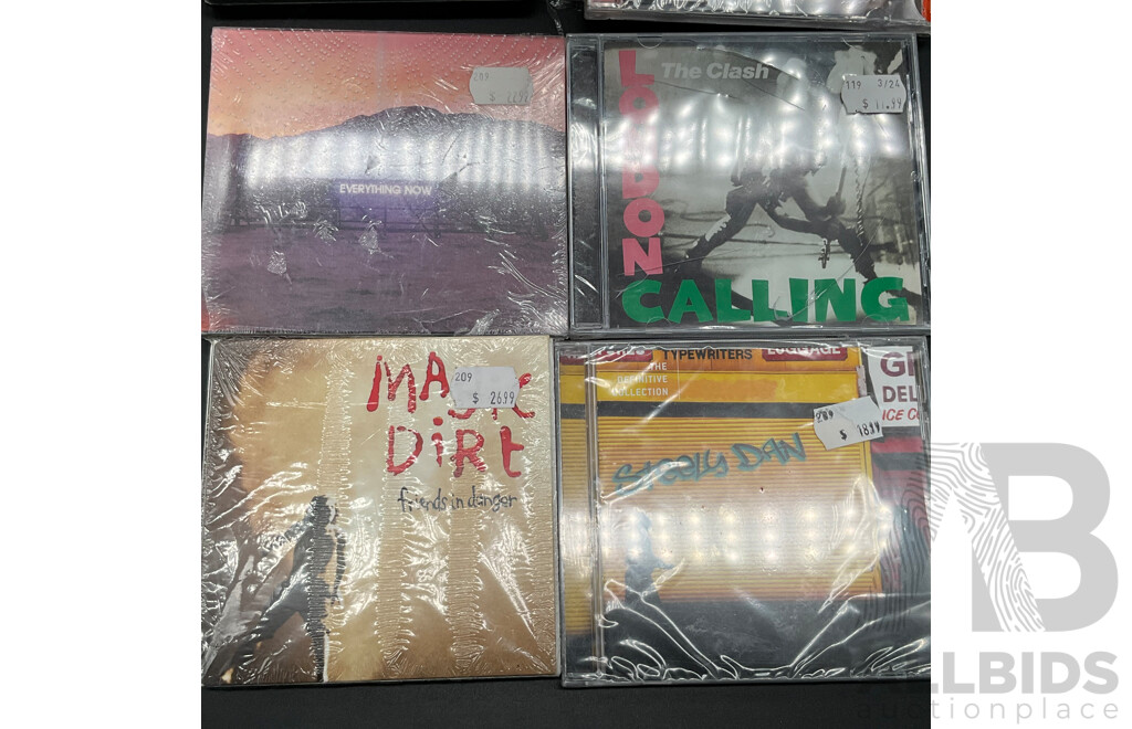 Assorted CDs/DVDs and Ultimate Ears Speaker