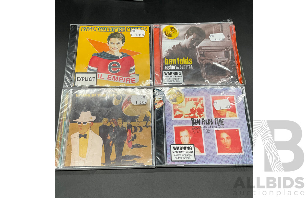 Assorted CDs/DVDs and Ultimate Ears Speaker