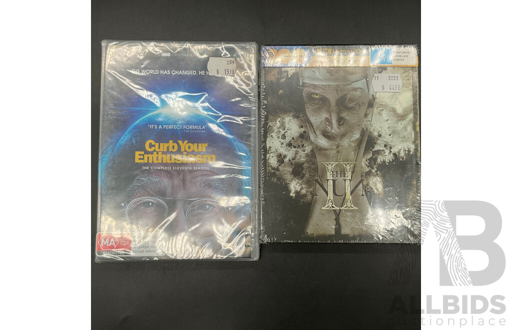 Assorted CDs/DVDs and Ultimate Ears Speaker