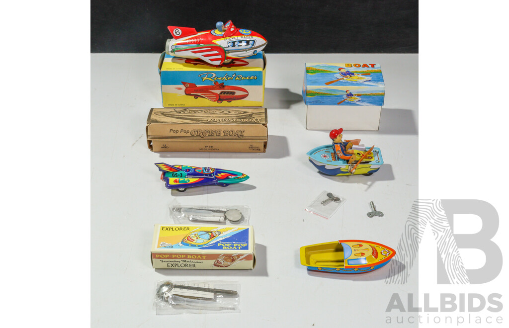 Four Pressed Steel Toys Including Rocket Racer, Rocket with Friction Motor, Clockwork Boat, Pop Pop Steam Boat