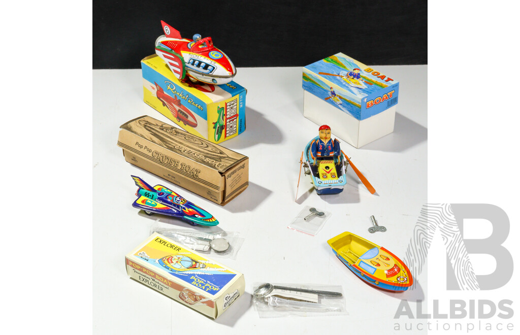 Four Pressed Steel Toys Including Rocket Racer, Rocket with Friction Motor, Clockwork Boat, Pop Pop Steam Boat