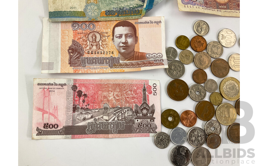 Collection of International Currency Including Switzerland 1944 Silver Two Francs, Thailand, Vietnam, Cambodia, UK, Indonesia, France, China