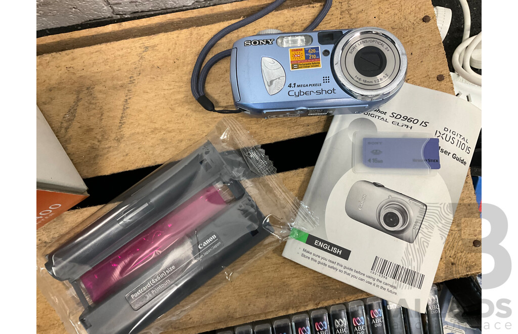 CANON Selphy Photo Printer with Accesories, SONY Digital Camera, Assorted DVD's, 3D Sync Transmitter and More