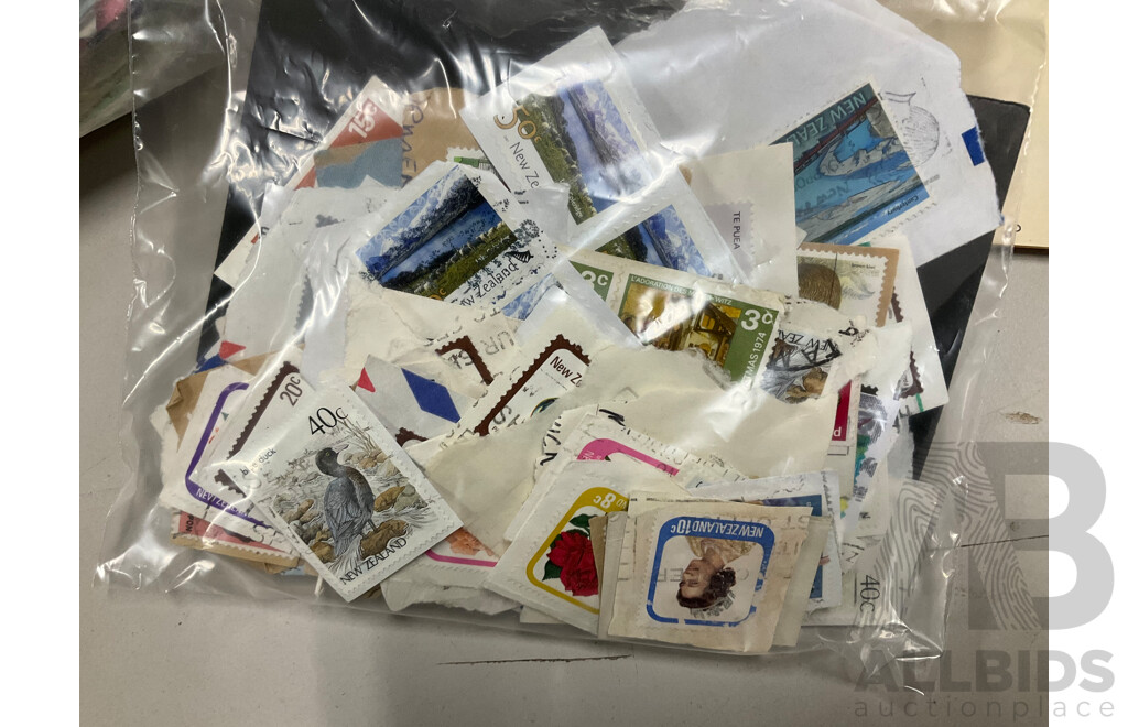 Collection of International Cancelled Stamps Including USA, New Zealand, Australia, UK, Germany, Malaysia, India, Romania, Italy and More - Approximately Two Kilograms