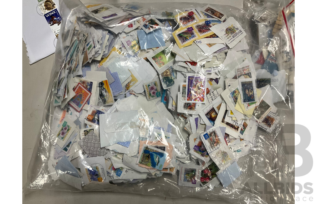 Collection of International Cancelled Stamps Including USA, New Zealand, Australia, UK, Germany, Malaysia, India, Romania, Italy and More - Approximately Two Kilograms
