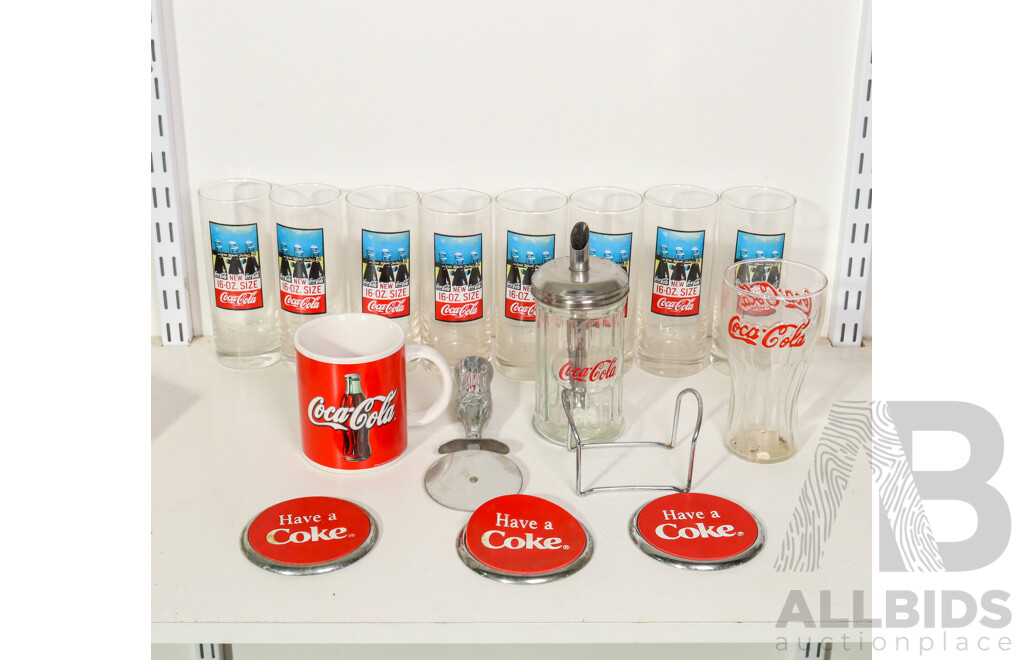 Collection of Coca Cola Paraphernalia Including Glass Cups, Pizza Cutter, Coasters and More