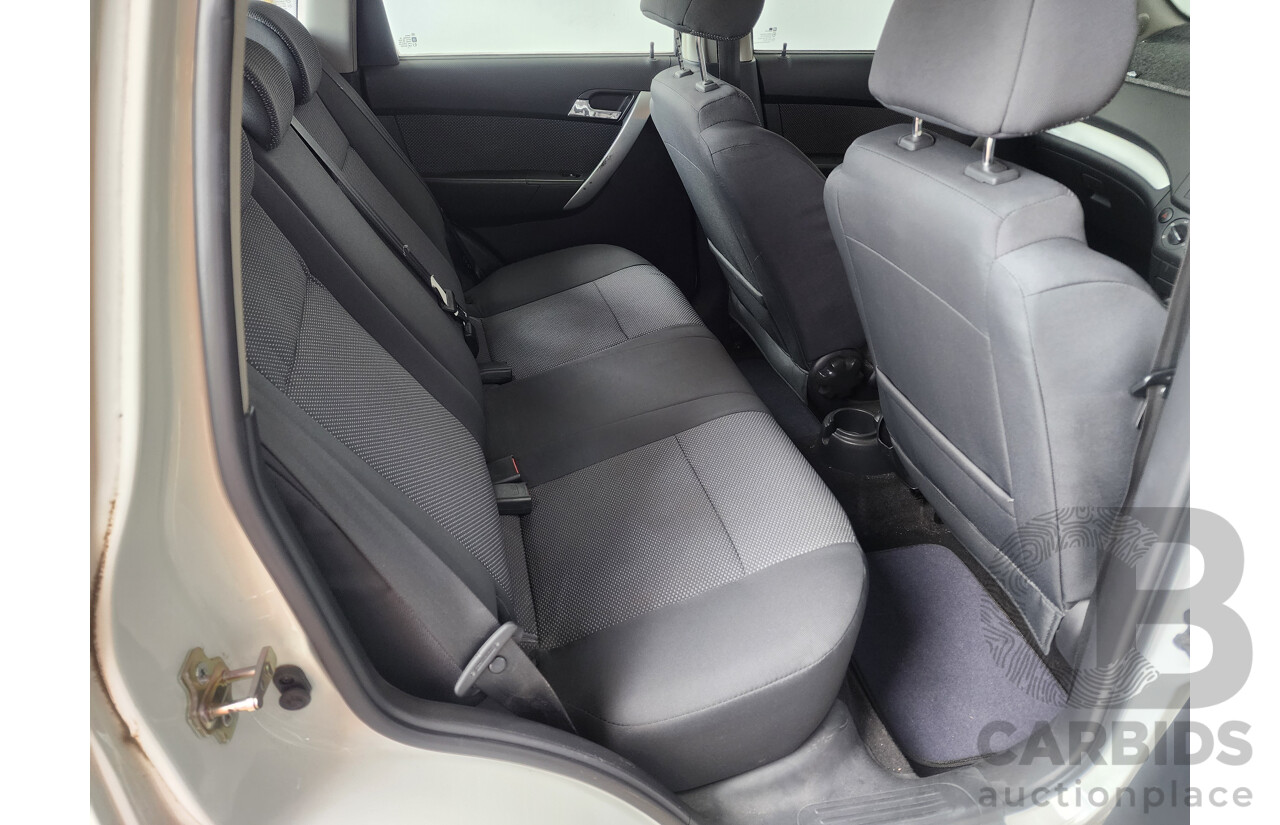 9/2011 Holden Barina  TK MY11 5d Hatchback White 1.6L