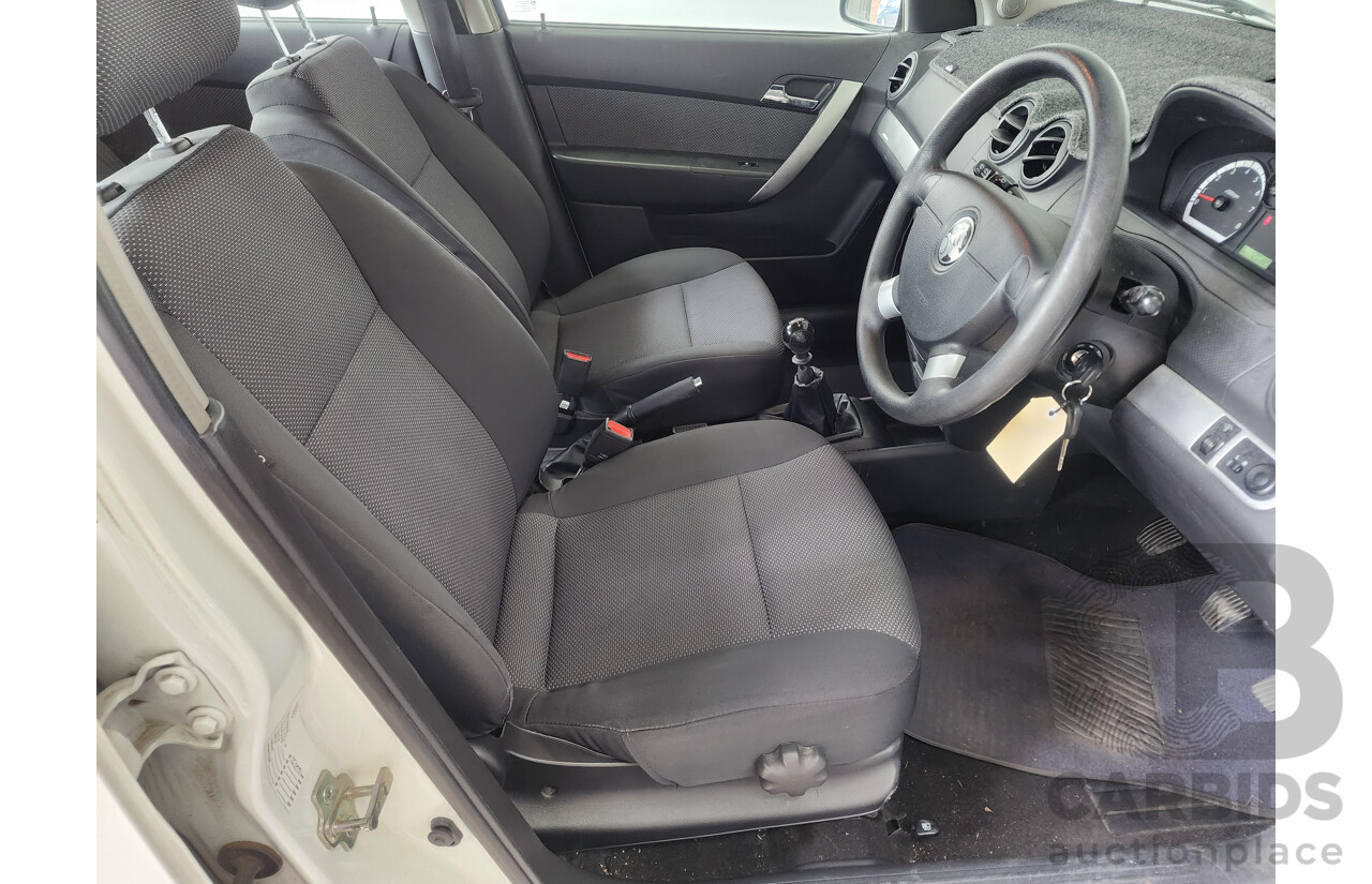 9/2011 Holden Barina  TK MY11 5d Hatchback White 1.6L