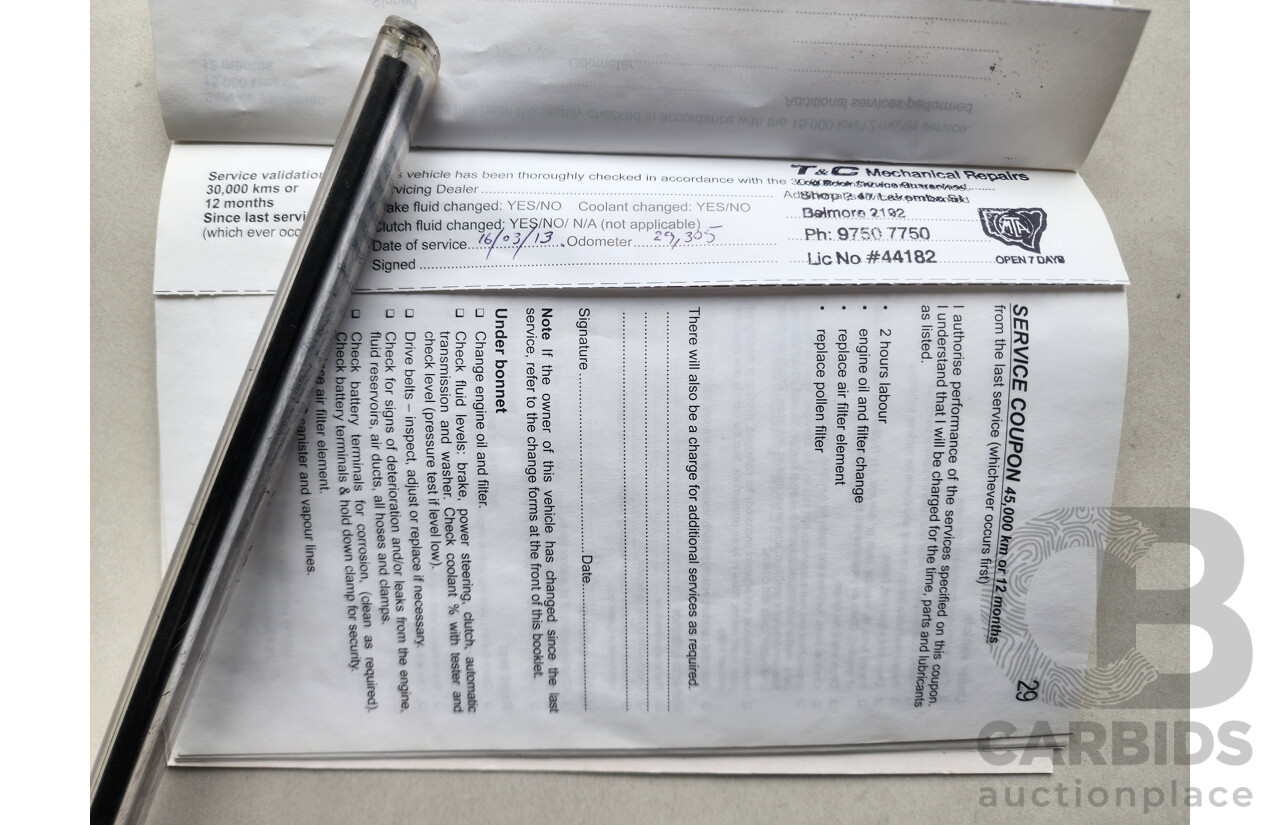 9/2011 Holden Barina  TK MY11 5d Hatchback White 1.6L