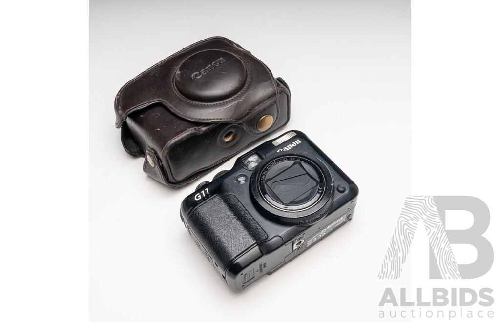 FujiFilm X-E1 Digital Camera with Fujinon Aspherical Super EBC XF 18–55mm F/2.8–4 Lens and Charger, with Canon PowerShot G11 Digital Camera with Leather Case and Charger